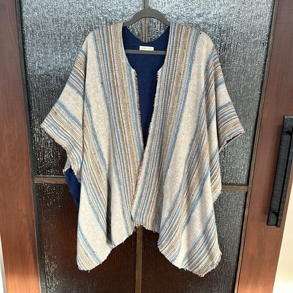 Jesse Kamm warming cape in a blue neutral stripe. One size - Picture 1 of 13